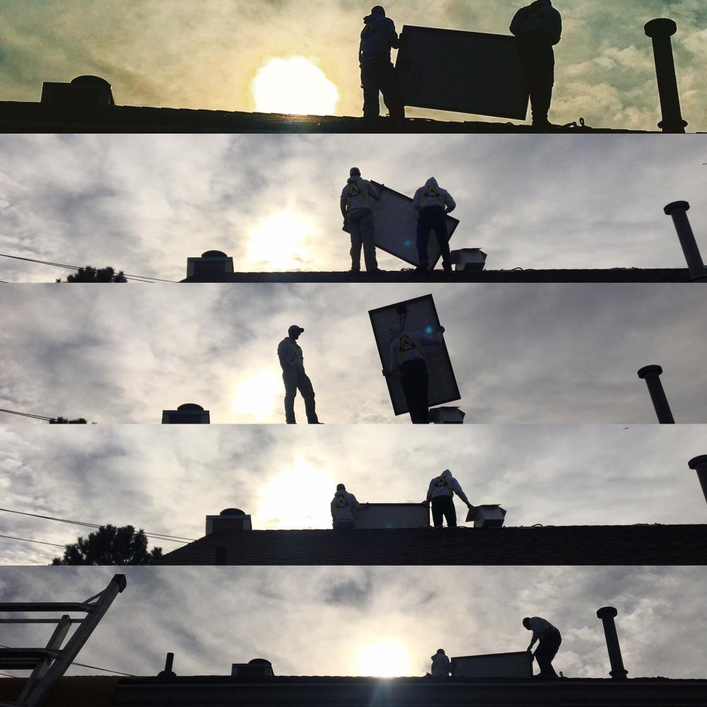 solar panel installed on rooftop by solar installers workers MnSEIA